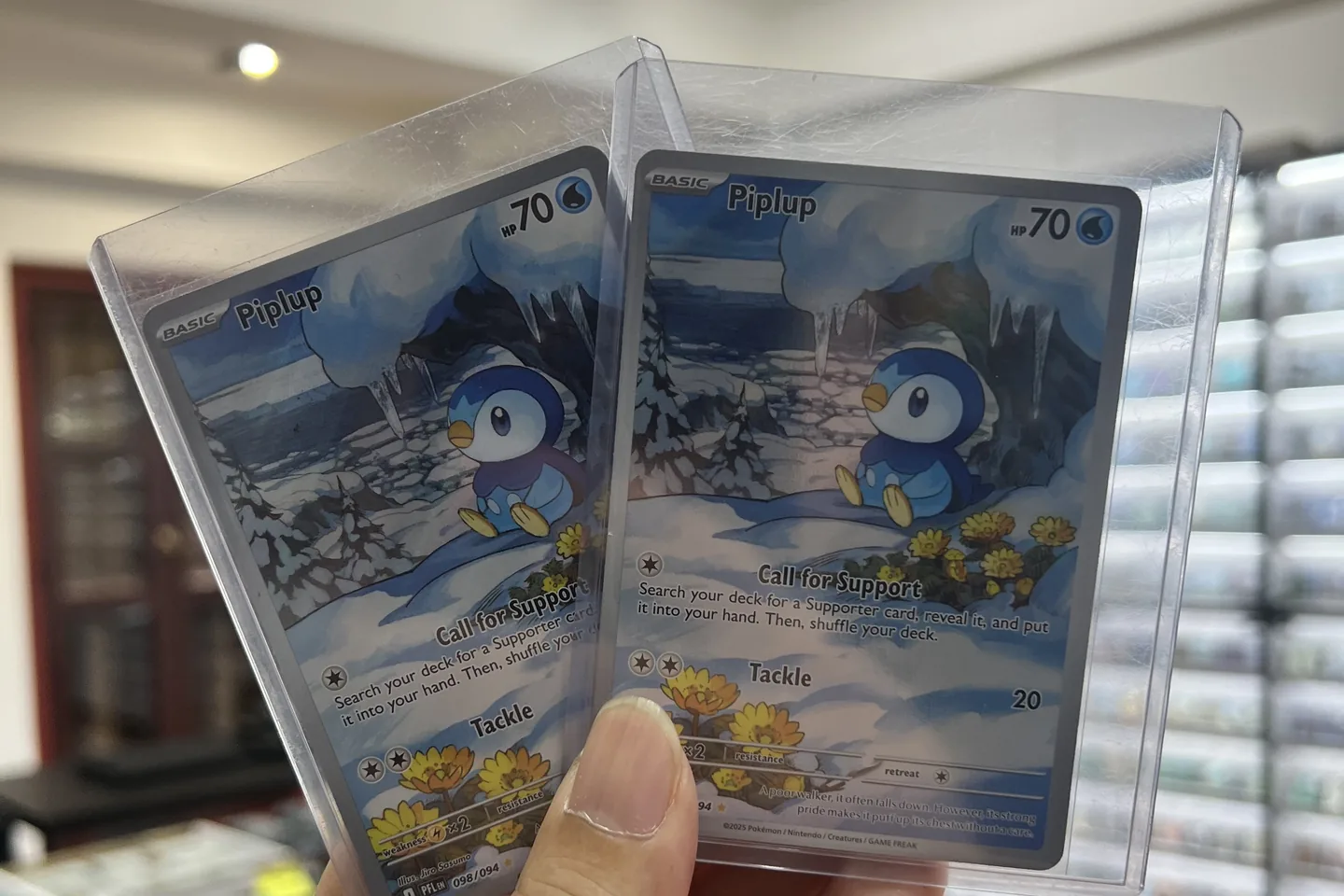 Two friends opening packs and showing their hits.